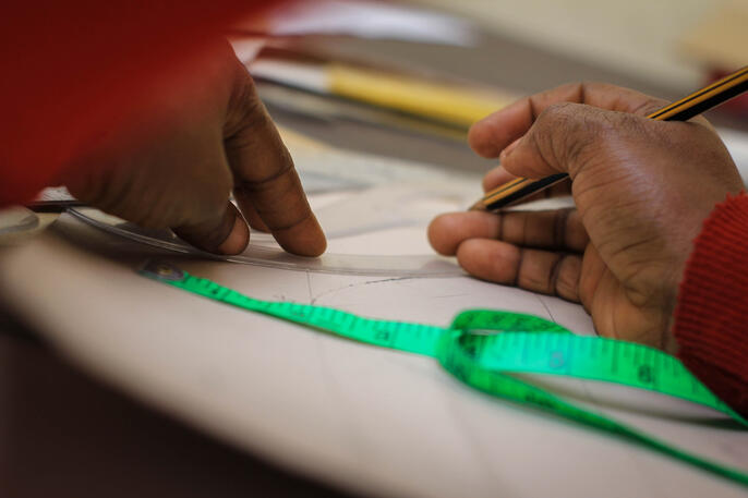 Girl drafting paper patterns