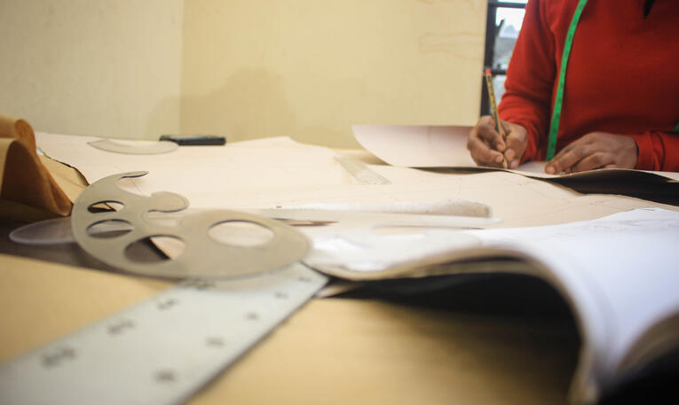 Girl working on paper patterns