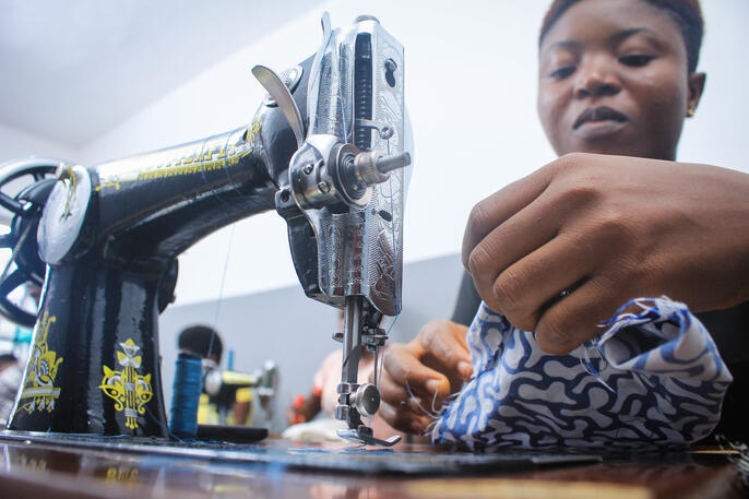 Girl sewing ankara