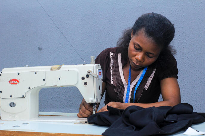 Girl sewing on machine
