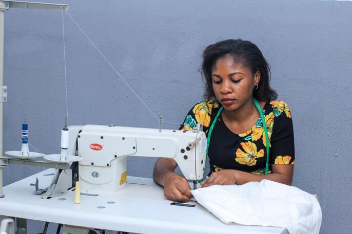Girl sewing on machine