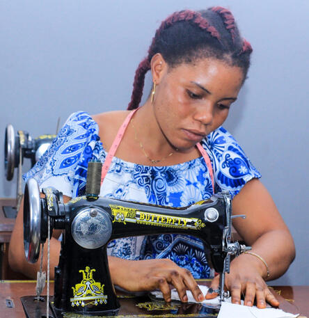 Girl sewing on machine
