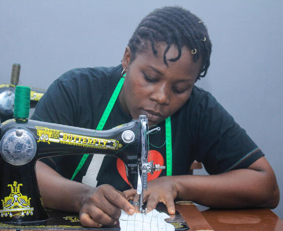 Girl sewing on machine