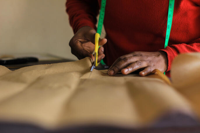 Girl cutting paper patterns